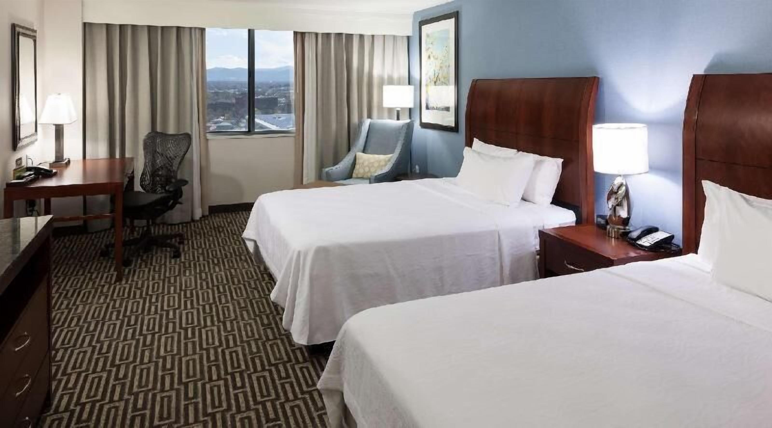 Premium bedding, desk, laptop workspace, iron/ironing board