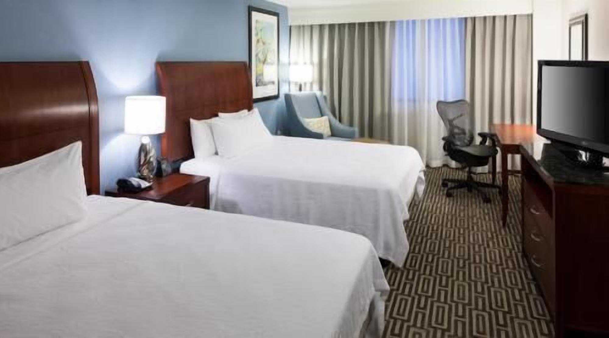 Premium bedding, desk, laptop workspace, iron/ironing board