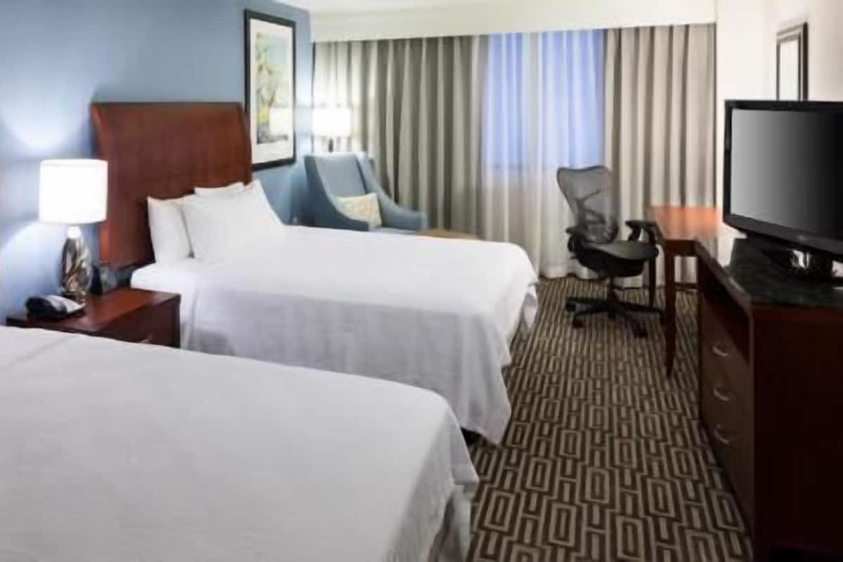 Premium bedding, desk, laptop workspace, iron/ironing board