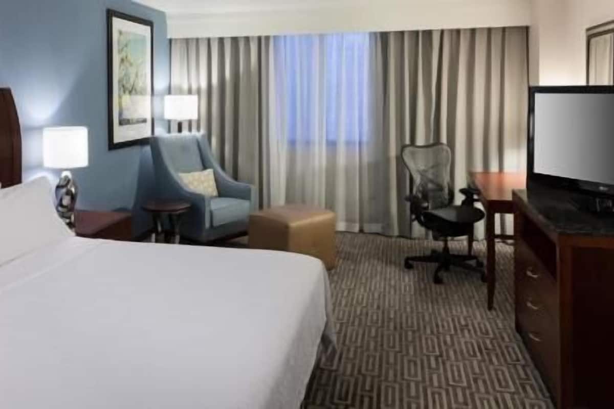 Premium bedding, desk, laptop workspace, iron/ironing board