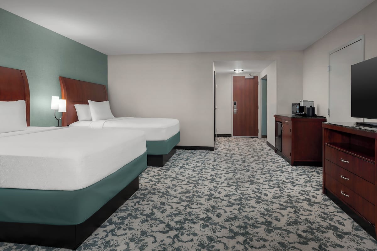 Premium bedding, desk, laptop workspace, iron/ironing board