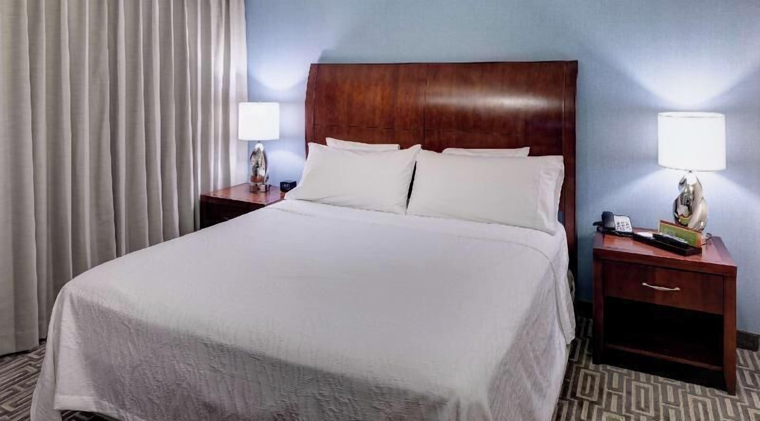 Premium bedding, desk, laptop workspace, iron/ironing board