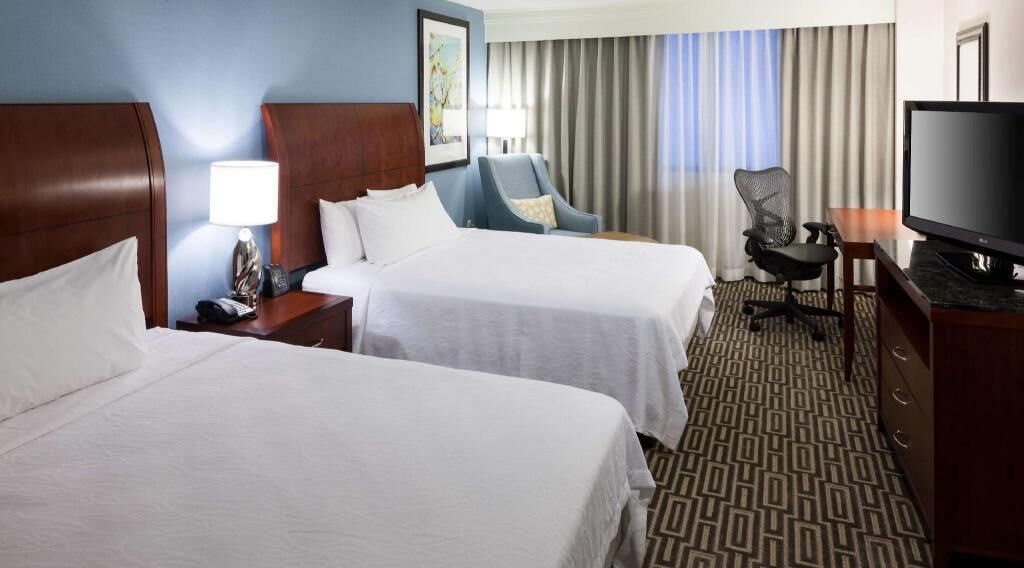 Premium bedding, desk, laptop workspace, iron/ironing board