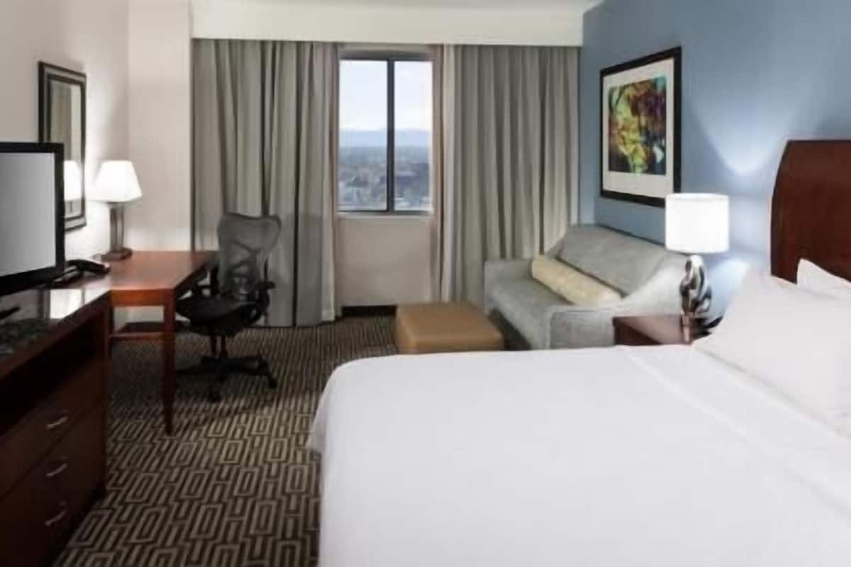 Premium bedding, desk, laptop workspace, iron/ironing board