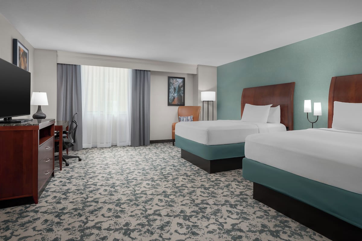 Premium bedding, desk, laptop workspace, iron/ironing board