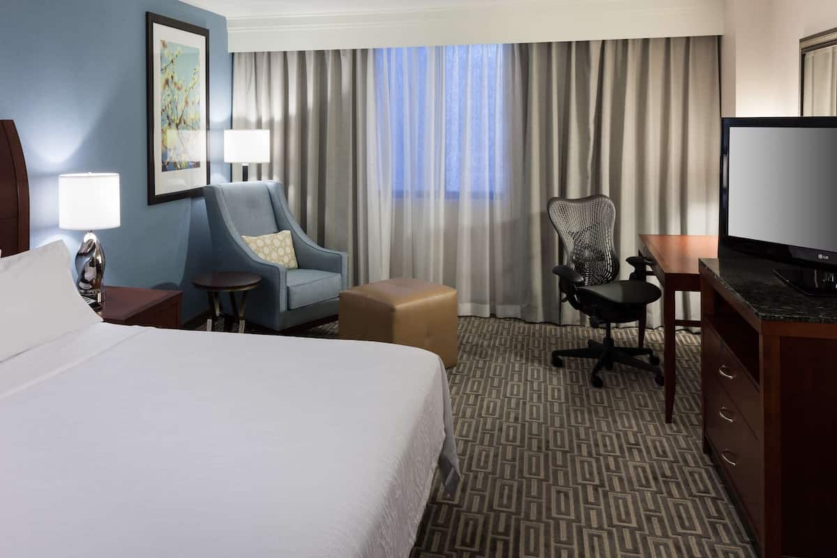 Premium bedding, desk, laptop workspace, iron/ironing board