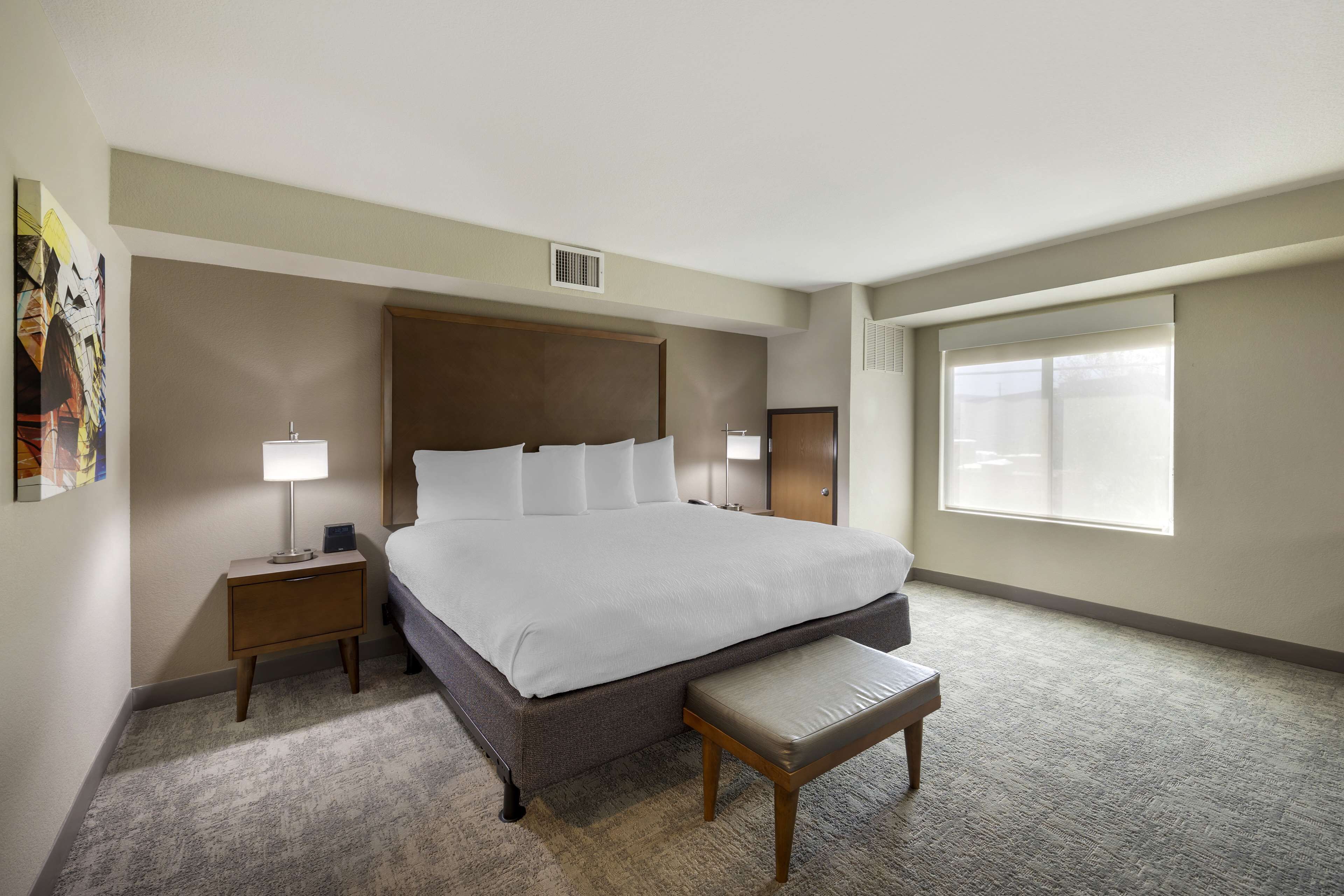 pillow-top beds, desk, laptop workspace, blackout curtains