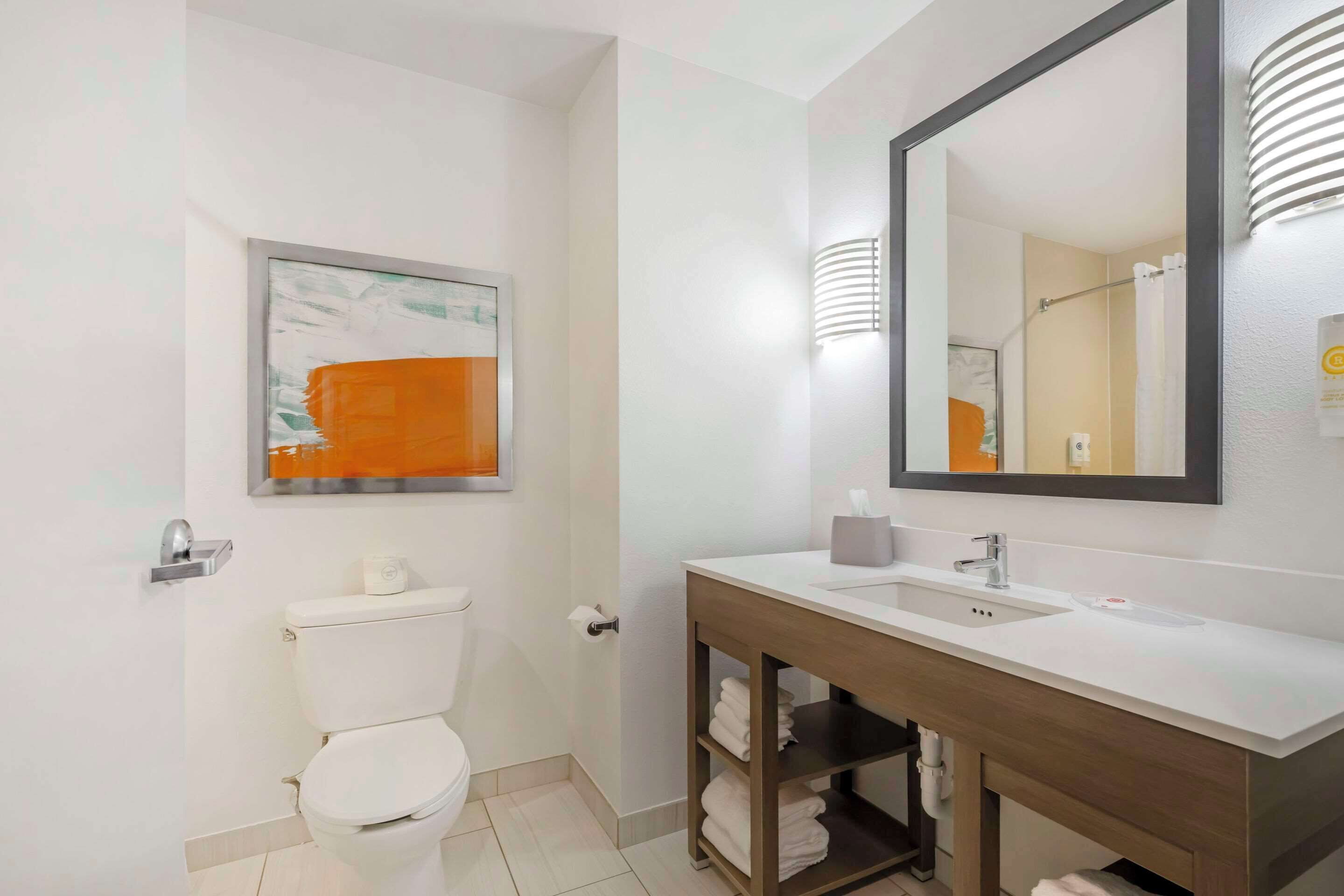 hydromassage showerhead, designer toiletries, hair dryer, towels