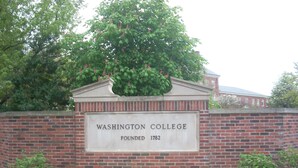 A brick wall with a sign stating "Washington College Founded 1782" and a tree above it. - Comfort Inn & Suites Chestertown (Chestertown)