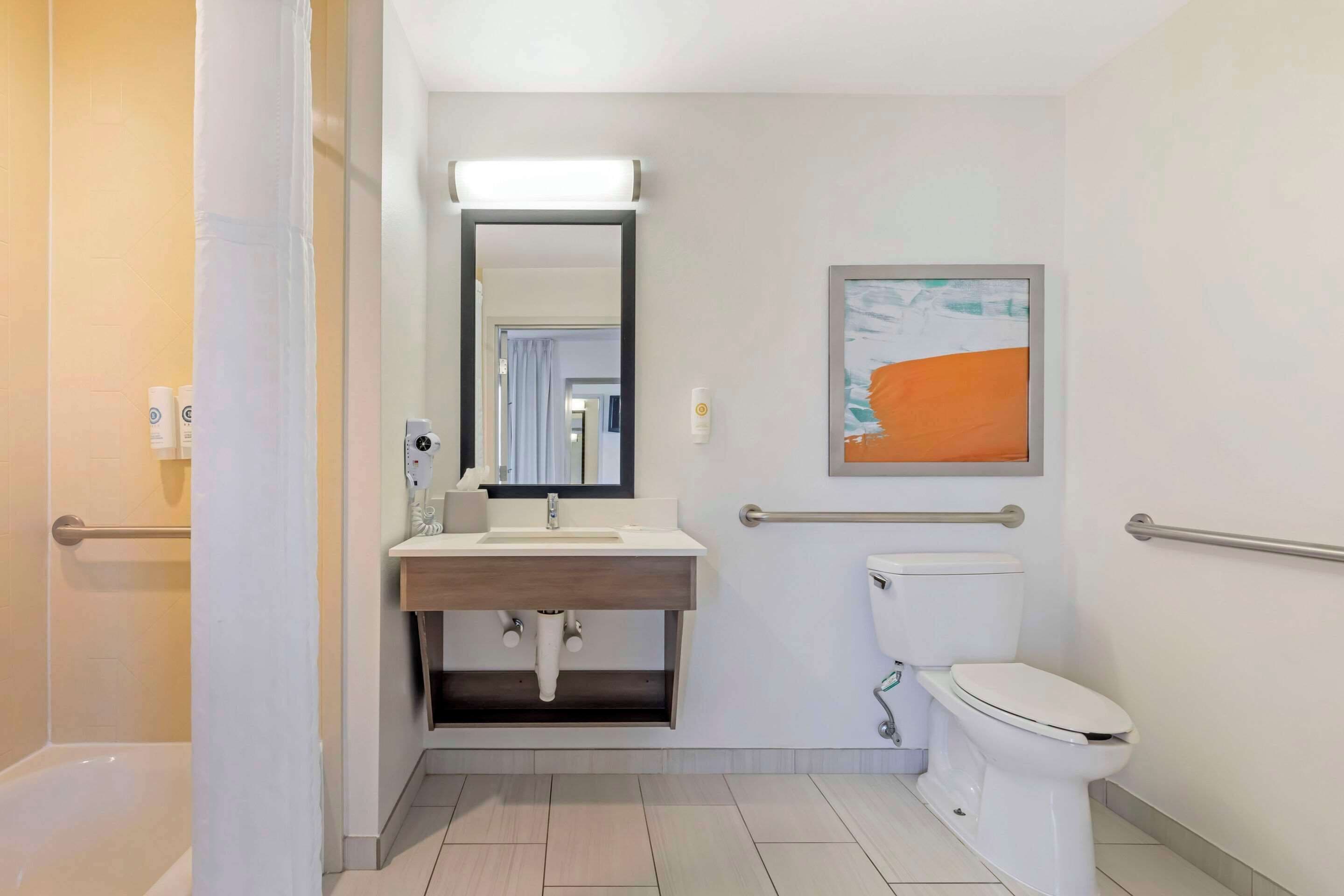 hydromassage showerhead, designer toiletries, hair dryer, towels