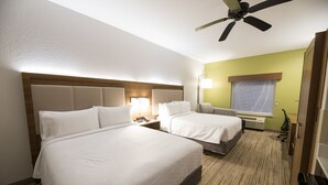 A hotel room with two beds, a ceiling fan, a nightstand with a lamp, and a window with curtains. - Holiday Inn Express Clinton by IHG (Clinton)