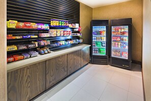 A snack bar with various packaged snacks and instant food items. - Holiday Inn Express Frisco Legacy Park Area by IHG (Frisco)