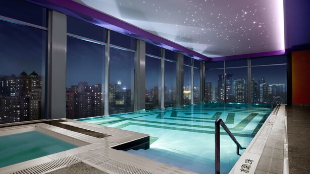 A rooftop infinity pool with city views, large windows, and a starry ceiling. - Renaissance Shanghai Yu Garden Hotel on the Bund by Nanjing Road (Shanghai)