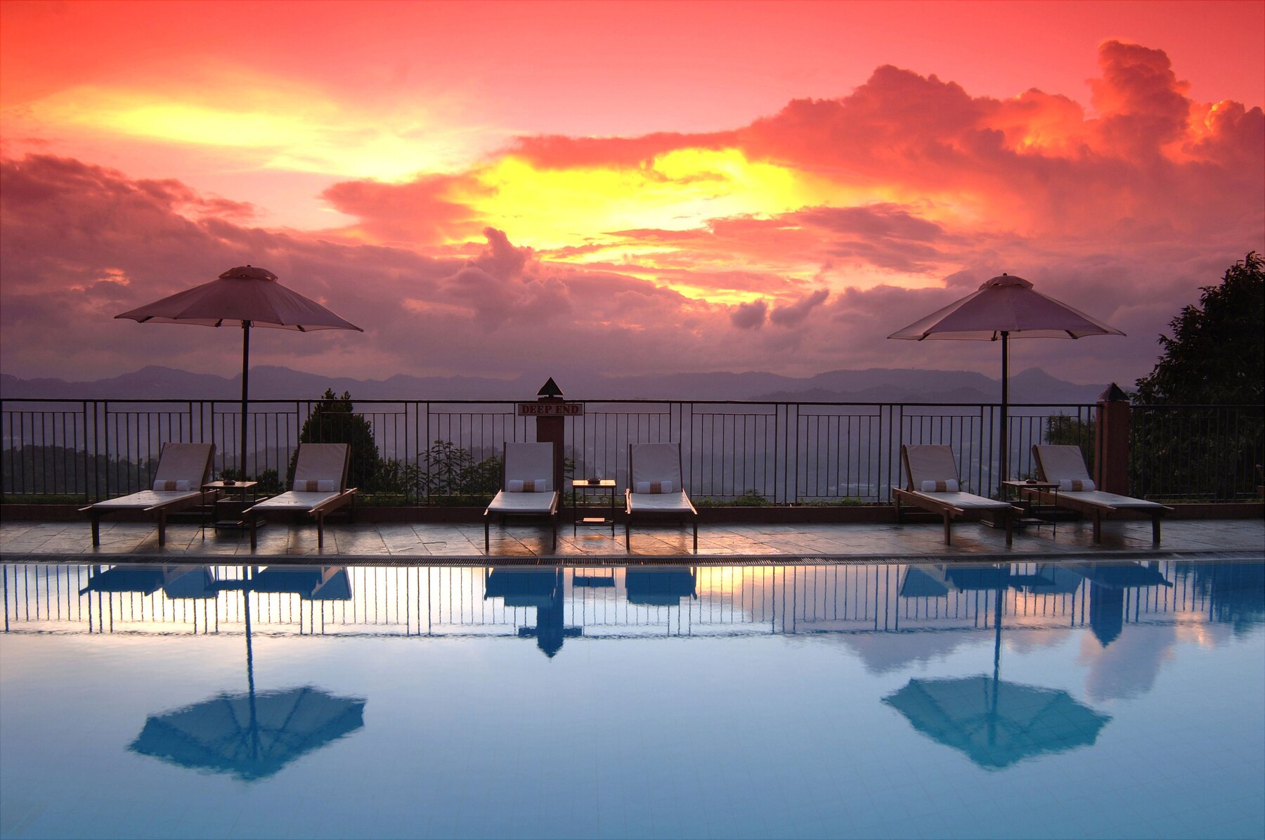 Outdoor pool, open 7:30 AM to 10:00 PM, pool umbrellas, pool loungers