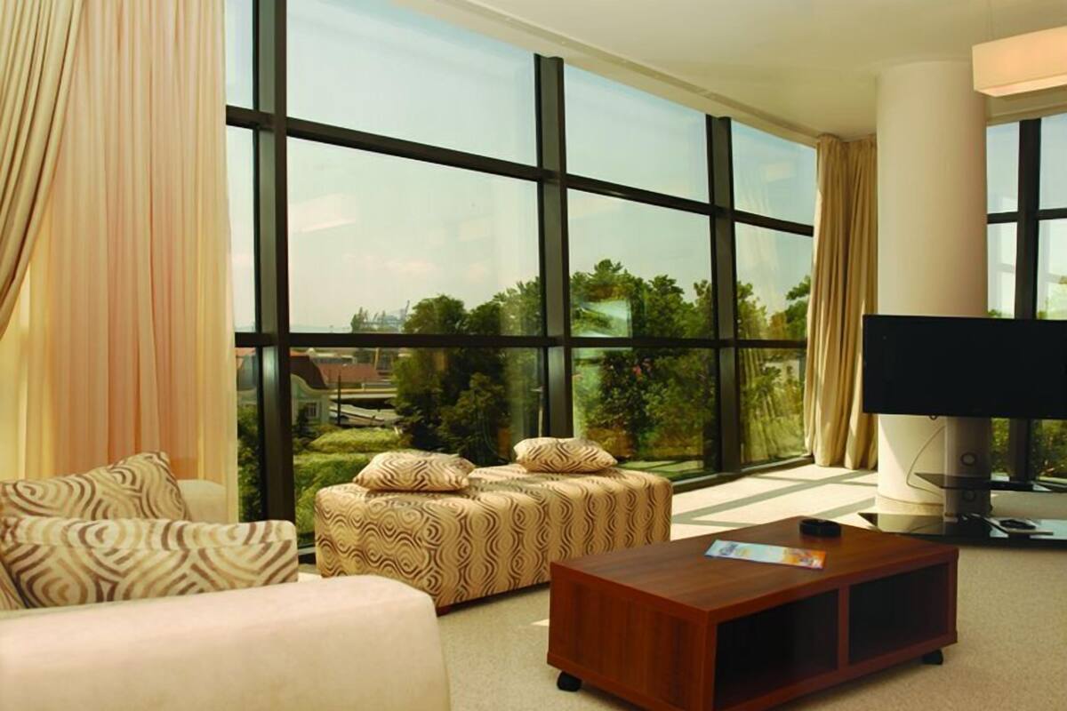 Suite (Free Wifi) | Living area | 21-inch LCD TV with cable channels, TV