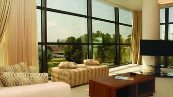 Suite (Free Wifi) | Living area | 21-inch LCD TV with cable channels, TV