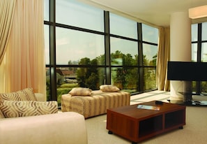 Suite (Free Wifi) | Living area | 21-inch LCD TV with cable channels, TV