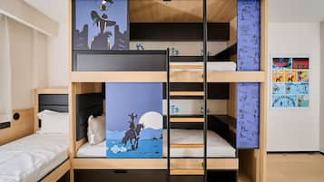 A bunk bed with three levels, each with a different wall art depicting a cowboy and a horse.