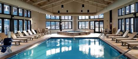 Indoor pool, open 10:00 AM to 10:00 PM, pool loungers