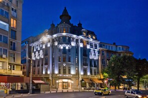 A historic building with a prominent entrance labeled "HOTEL VENEZIA," featuring classic architecture with multiple stories and a central tower. - Zeus Essence Bucharest Venezia (Bucharest)