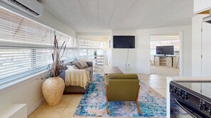 Deluxe Apartment, 2 Bedrooms, 2 Bathrooms | Living area | 50-inch TV with cable channels