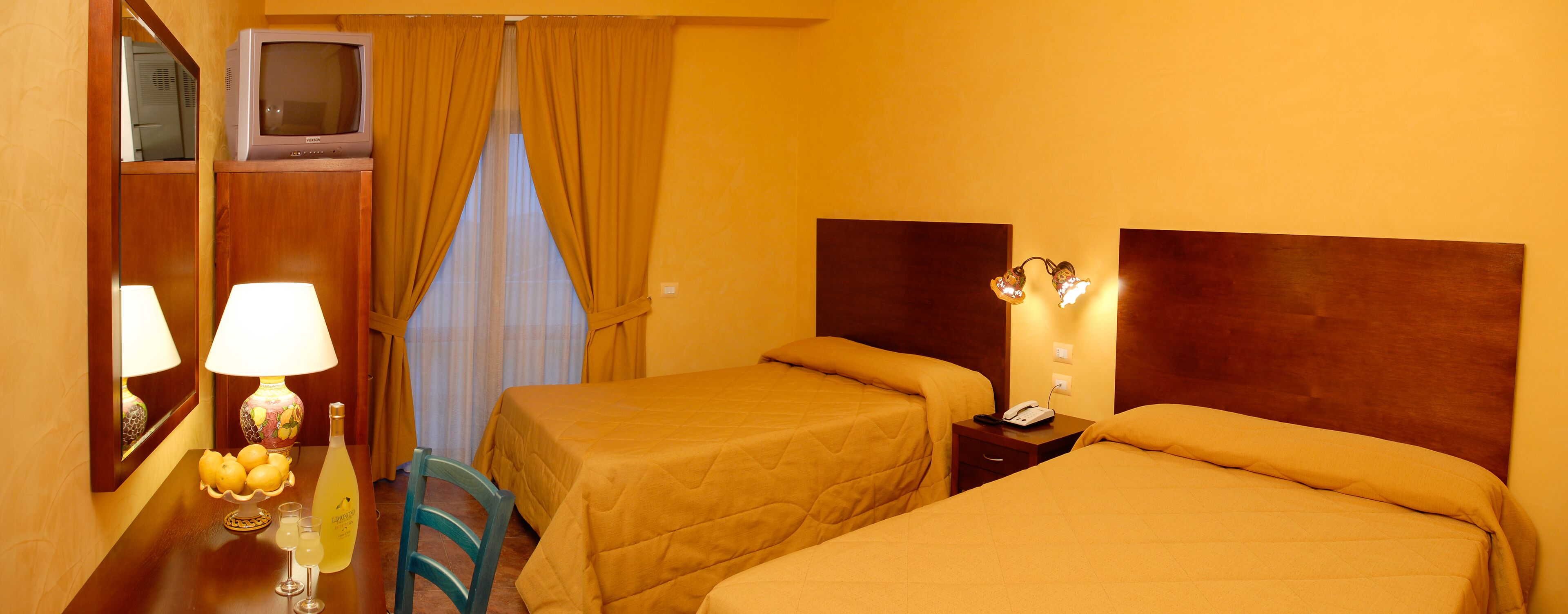 triple room, multiple beds | in-room safe, individually decorated, desk, blackout curtains