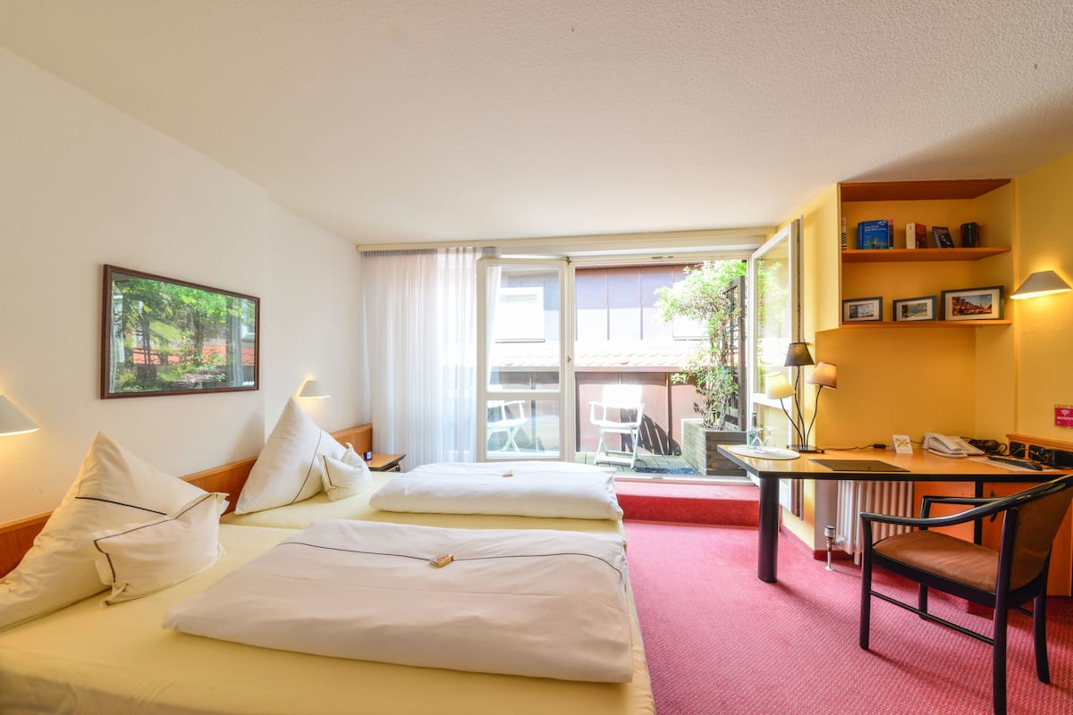 Quarto standard | Roupas de cama antialérgicas, cofres nos quartos, escrivaninha