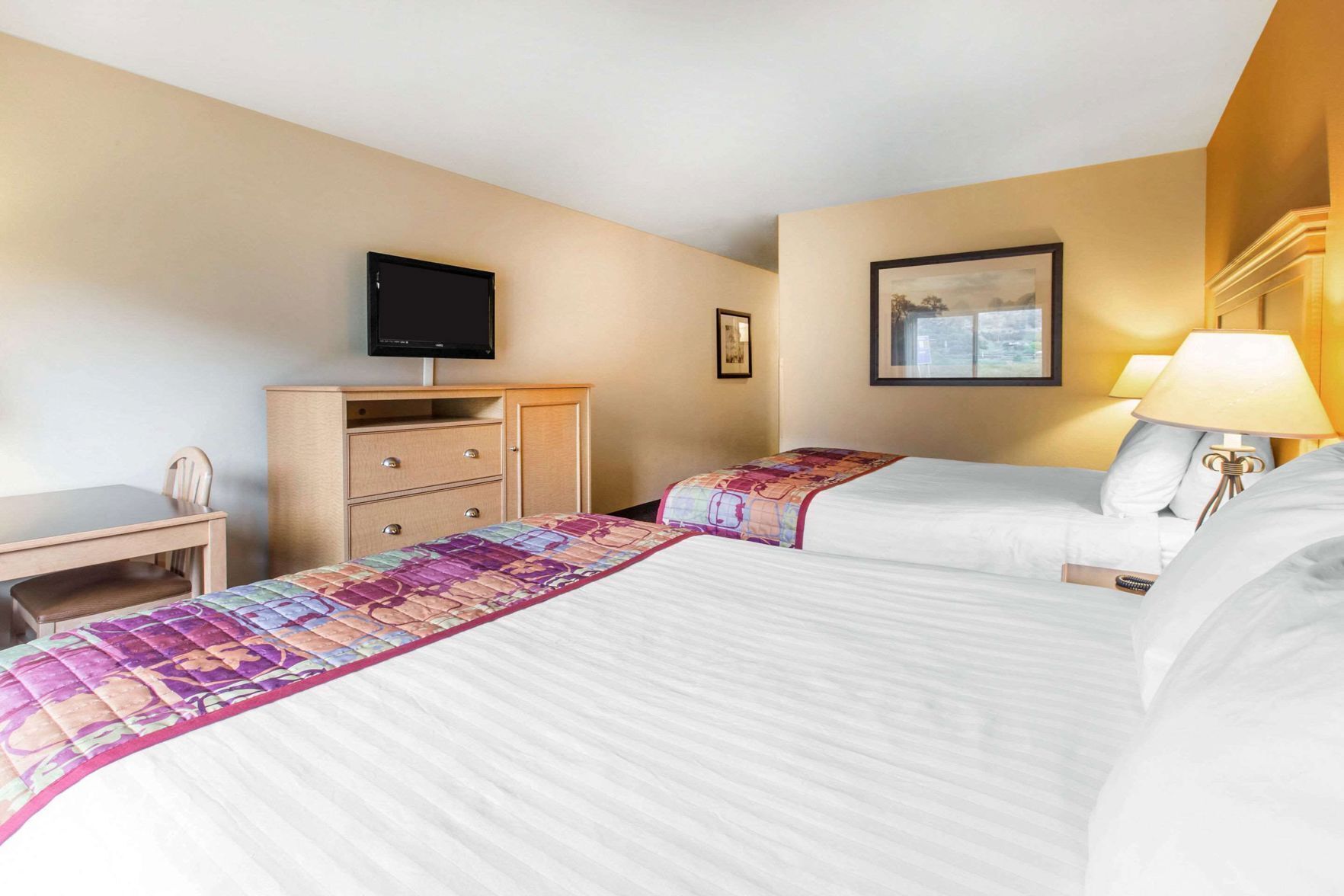 Premium bedding, desk, laptop workspace, blackout curtains