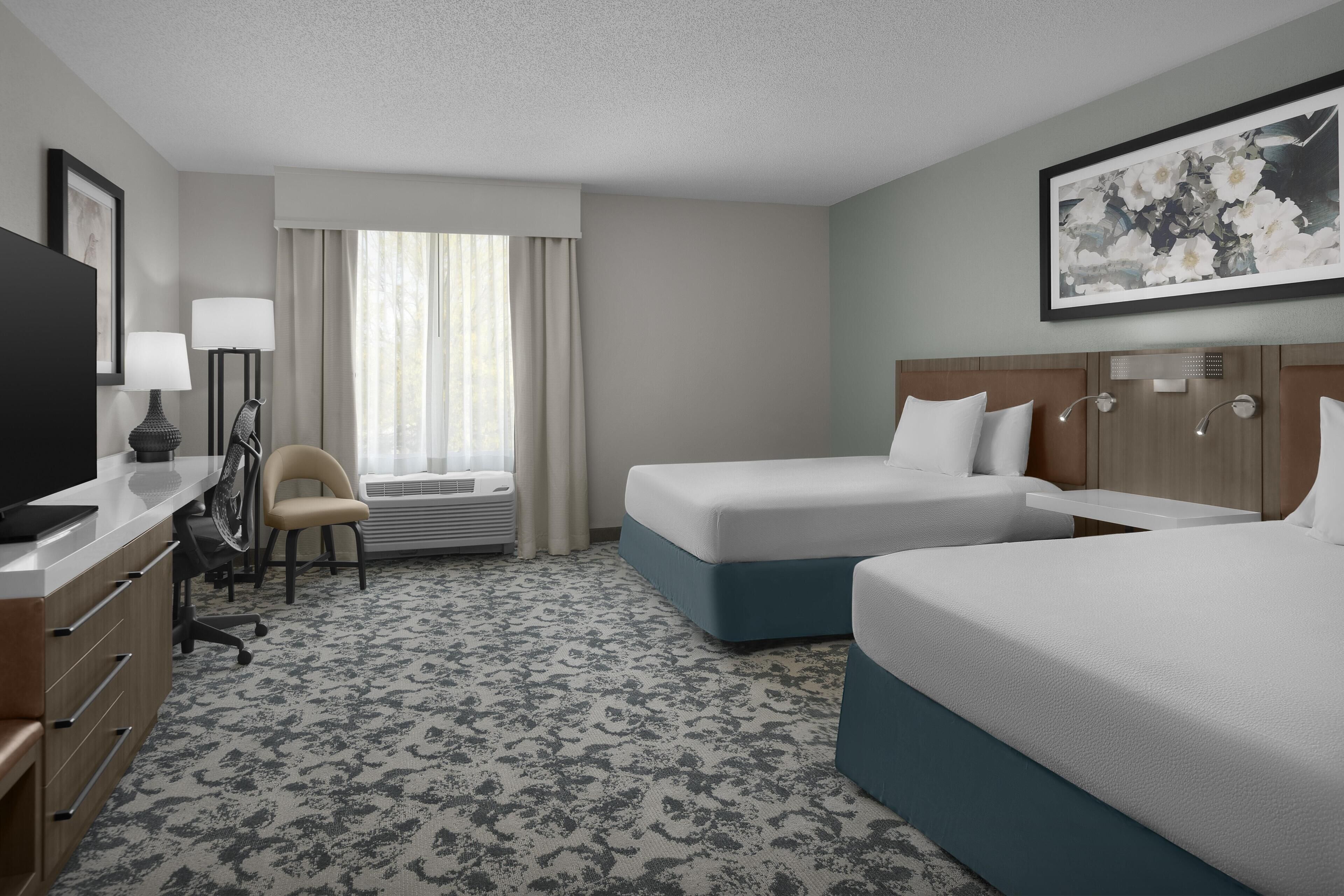 Premium bedding, desk, laptop workspace, blackout curtains