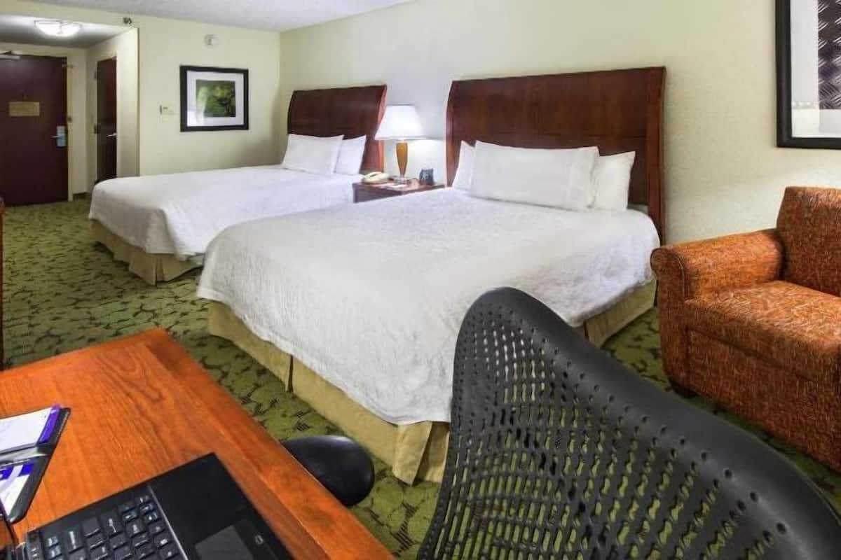 Premium bedding, desk, laptop workspace, blackout curtains