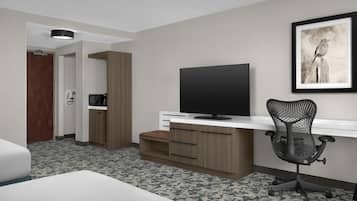 Premium bedding, desk, laptop workspace, blackout drapes
