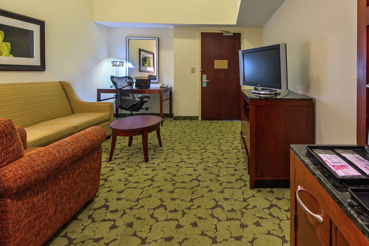 one king bed suite | premium bedding, desk, laptop workspace, blackout curtains