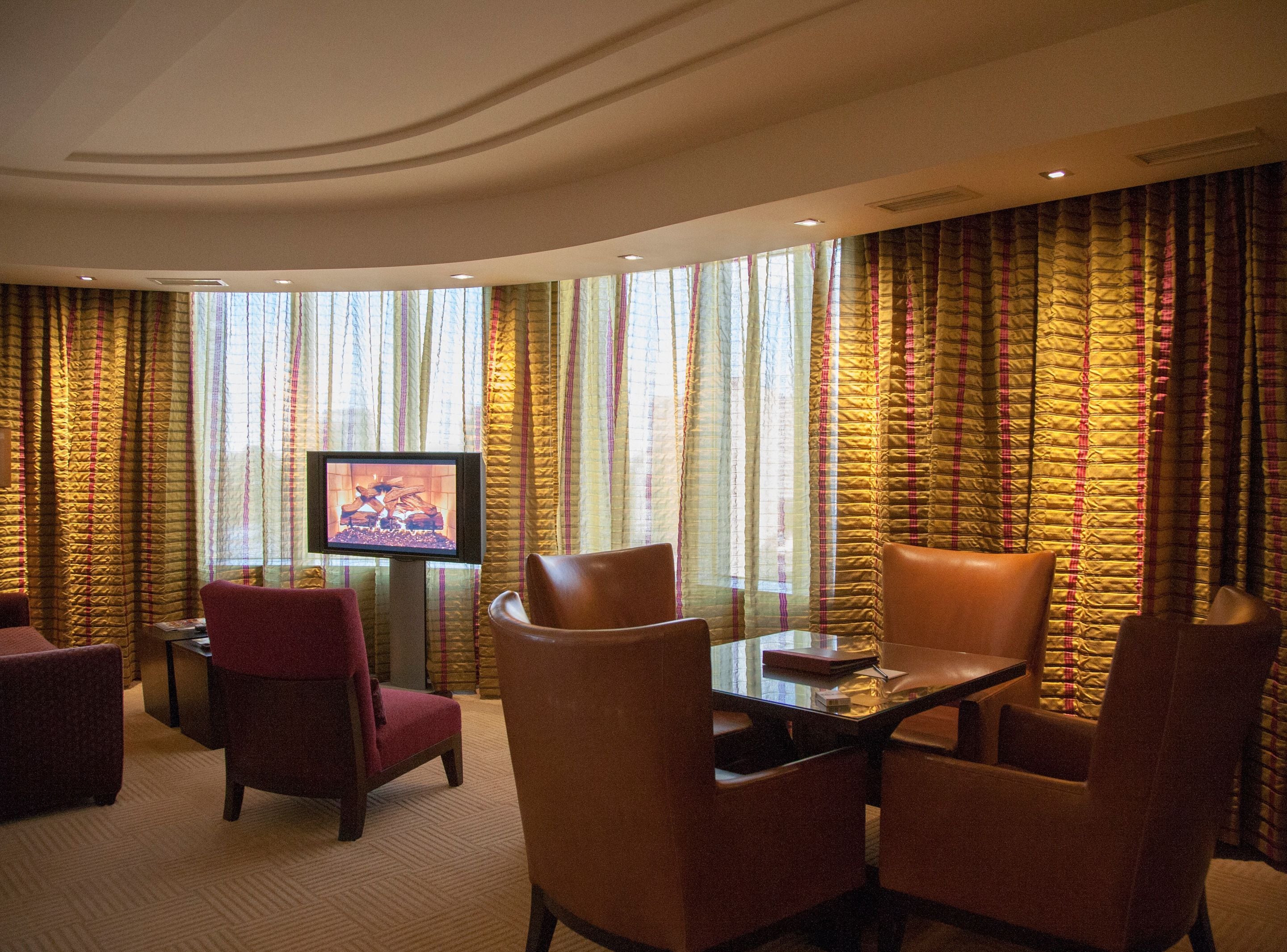executive suite, 1 king bed, corner | living room | 50-inch plasma tv with cable channels, tv, pay films