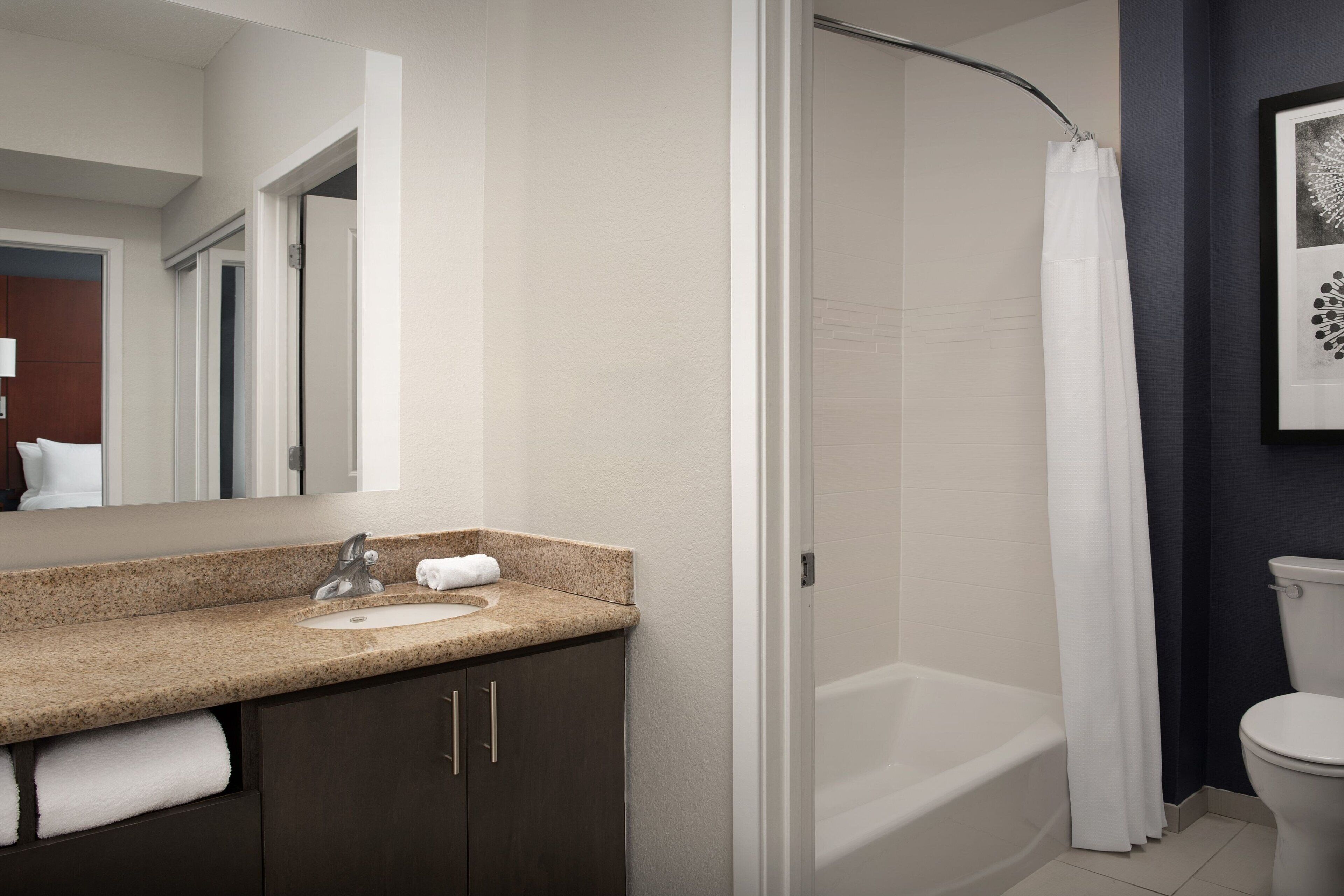 suite, 1 bedroom, non smoking, fireplace | bathroom | combined shower/bathtub, free toiletries, hair dryer, towels