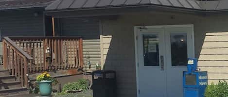 A building with a sign reading "OFFICE" above the entrance.