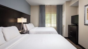 A hotel room with two beds, a TV, a desk, and a window with curtains. - Staybridge Suites Fairfield Napa Valley Area by IHG (Fairfield)