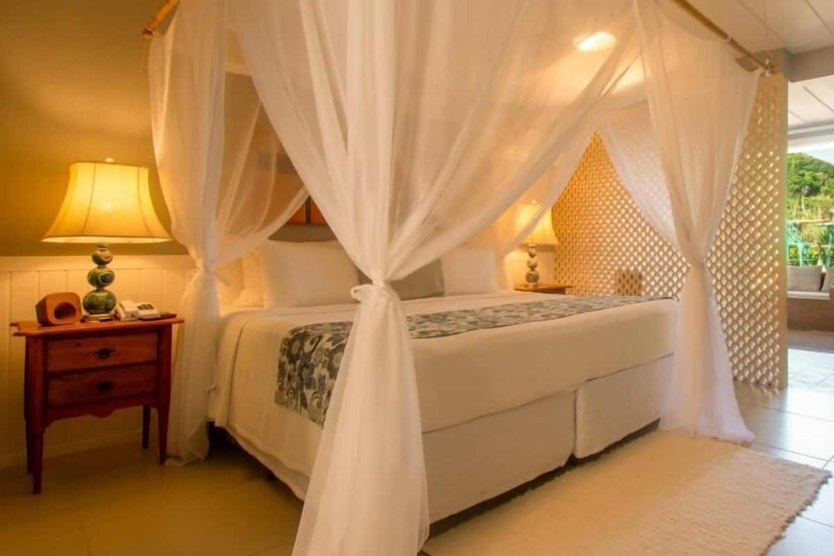Suite, 1 King Bed, Hot Tub, Partial Ocean View | 1 bedroom, minibar, in-room safe, individually decorated