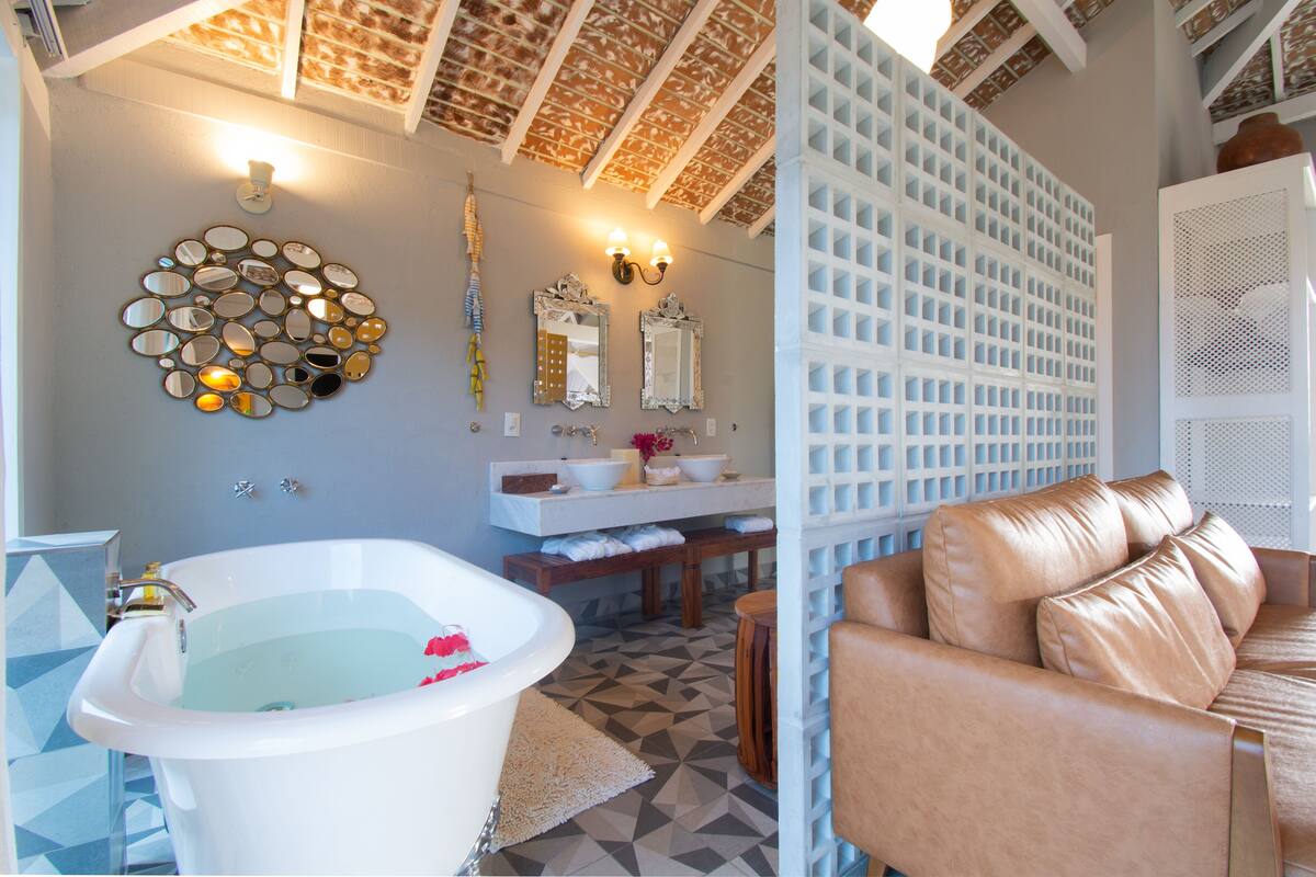 premier suite, 1 king bed, hot tub, partial ocean view | bathroom | hair dryer, towels, soap, toilet paper