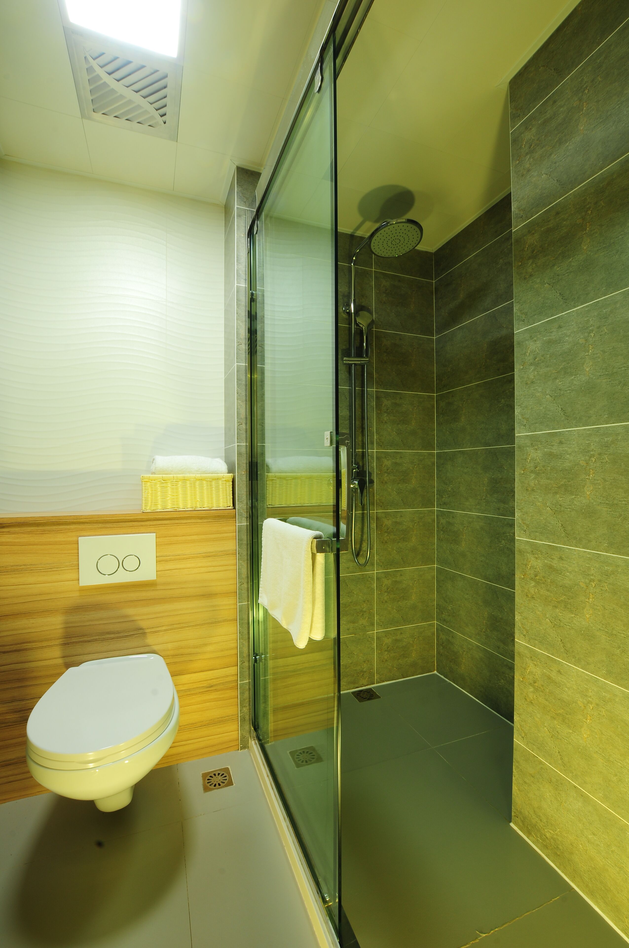 separate bathtub and shower, rainfall showerhead, slippers, towels