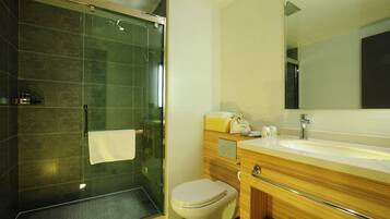 Separate bathtub and shower, rainfall showerhead, slippers, towels