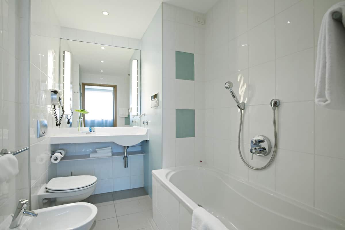 separate bathtub and shower, eco-friendly toiletries, hair dryer, bidet