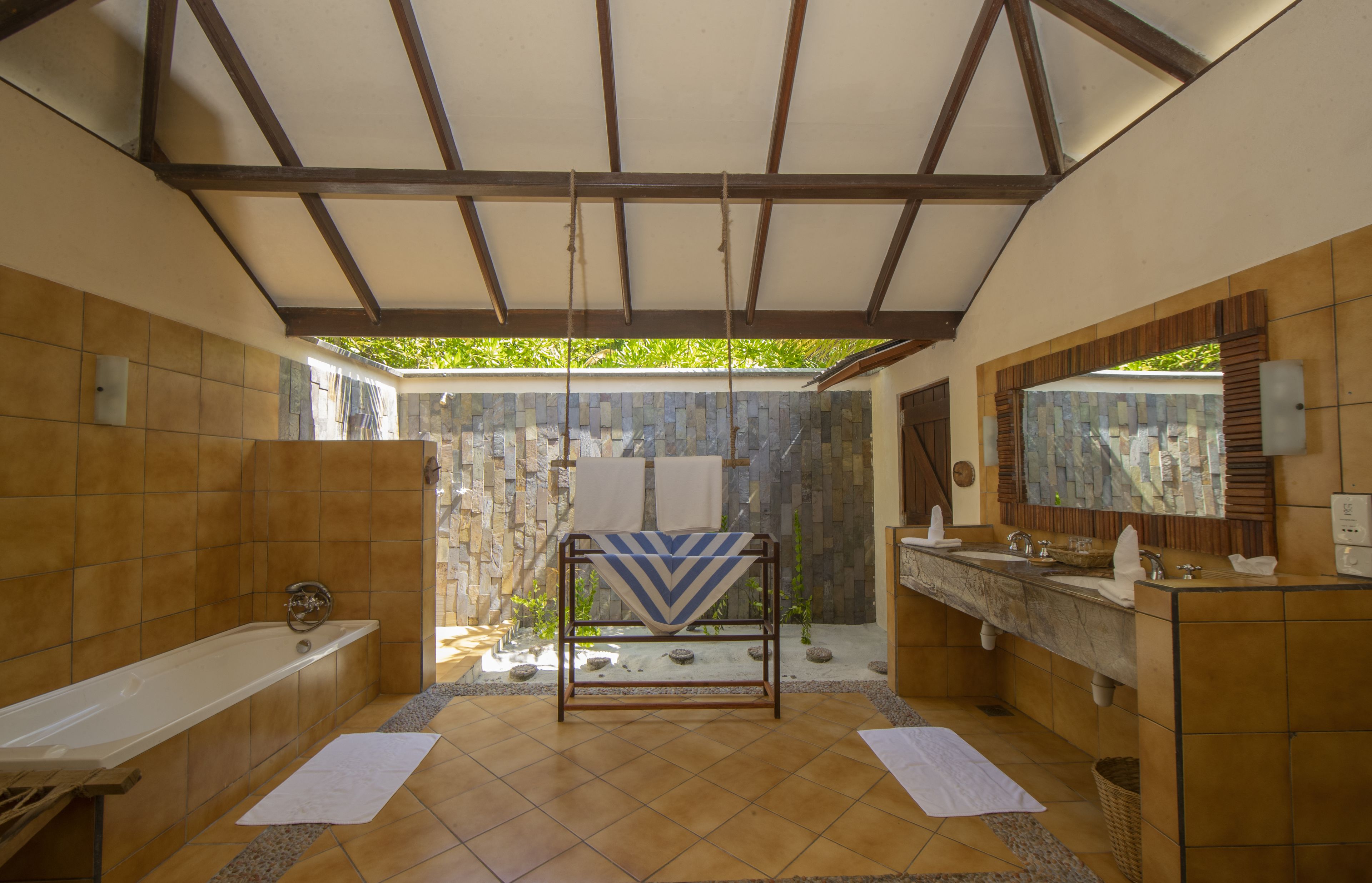 deluxe villa with beach view | bathroom | shower, free toiletries, hair dryer, bathrobes