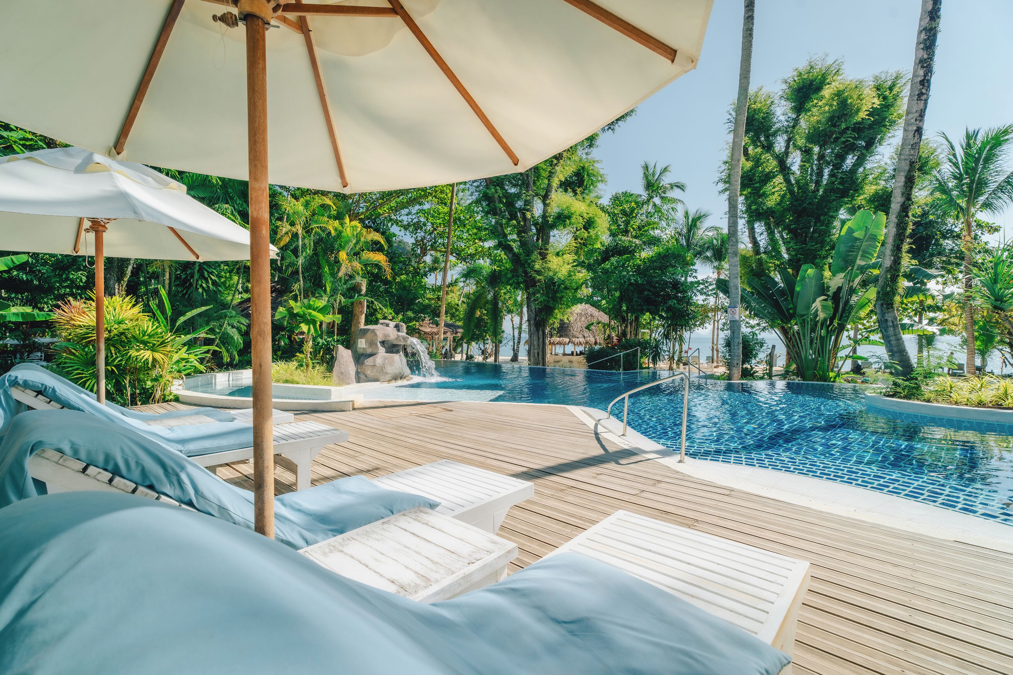 Outdoor pool, open 6:00 AM to 6:00 PM, pool umbrellas, pool loungers