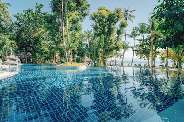 Outdoor pool, open 6:00 AM to 6:00 PM, pool umbrellas, pool loungers