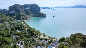 Escape to a tranquil hillside retreat with breathtaking ocean views and access to water activities.