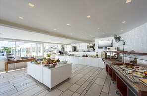 A modern kitchen with a central island, ample counter space, and a variety of appliances.
