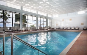 Indoor pool, open 8:00 AM to 7:00 PM, pool umbrellas, pool loungers
