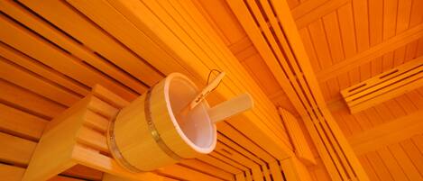 A wooden ceiling with a hanging bucket.