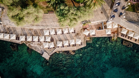 White sand, sun loungers, beach umbrellas, beach towels