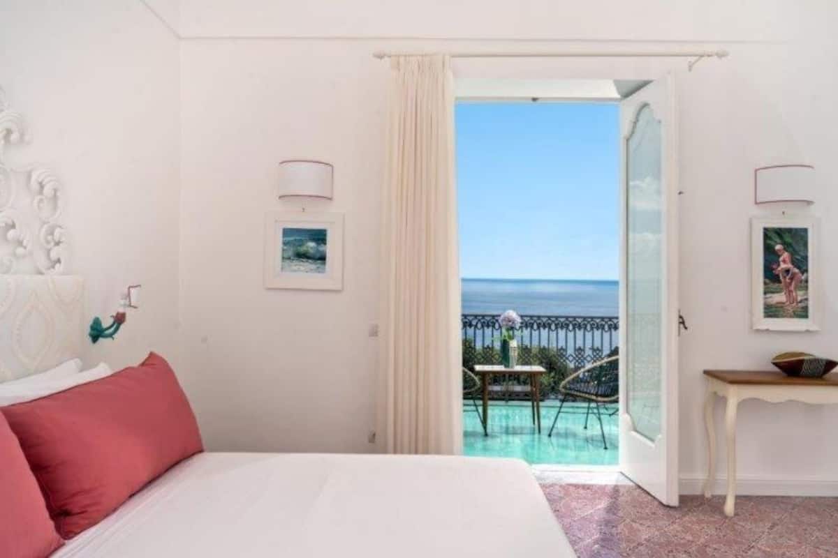 elite suite, sea view, annex building | minibar, in-room safe, desk, blackout curtains